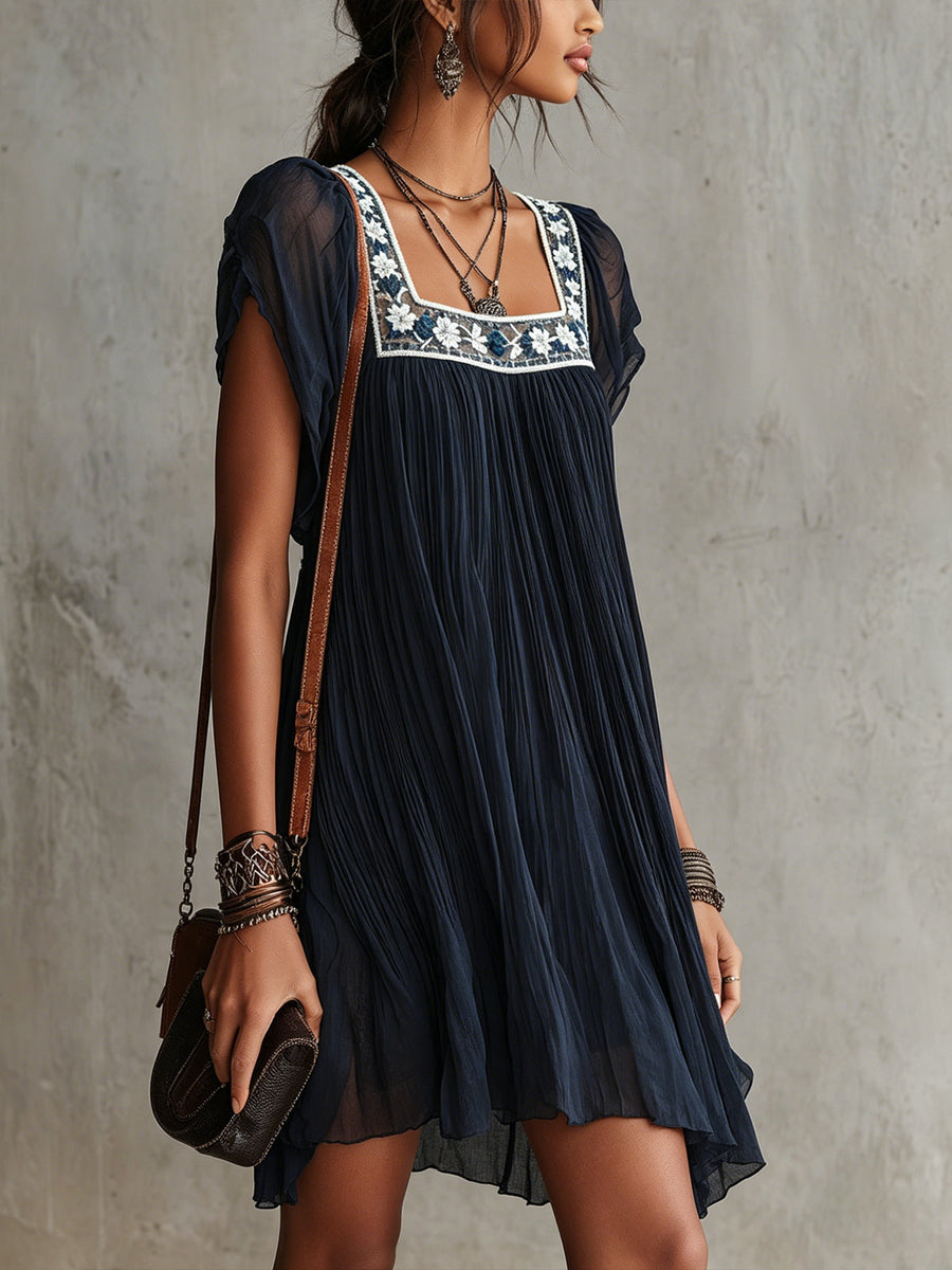 APOLLINE | NAVY FLORAL-EMBROIDERED PLEATED MINI DRESS